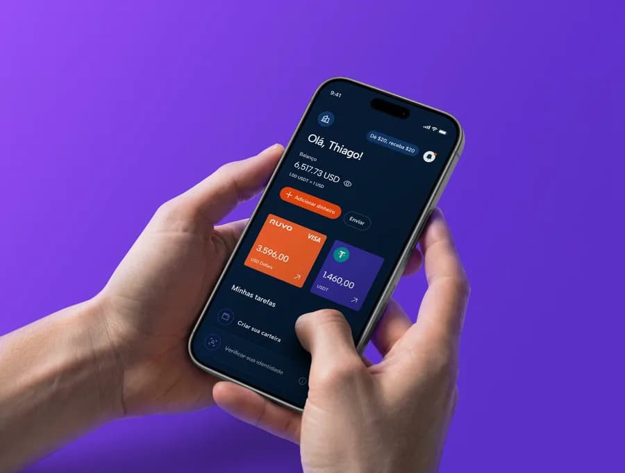 Hand holding a phone with the Ruvo app on a purple background