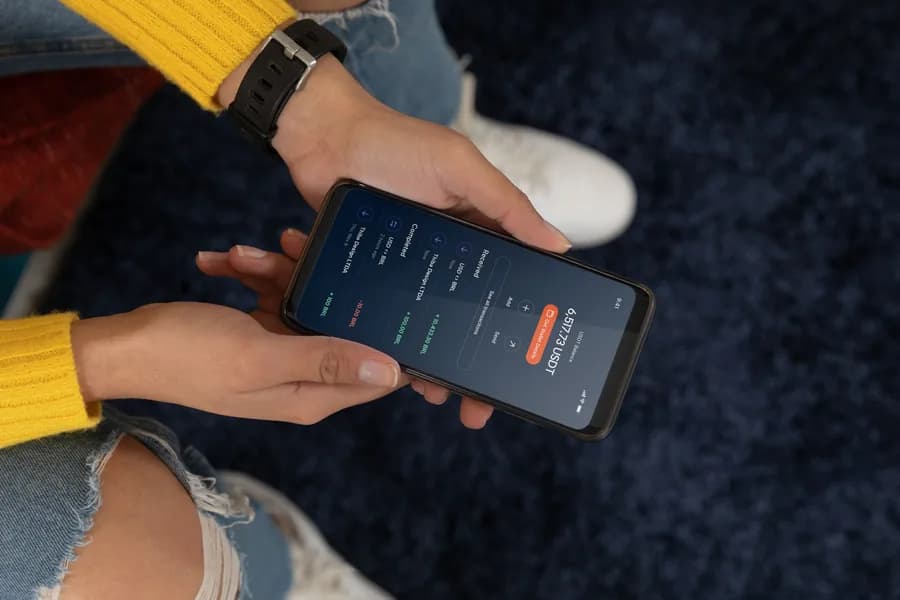 Two people checking the Ruvo app on a phone