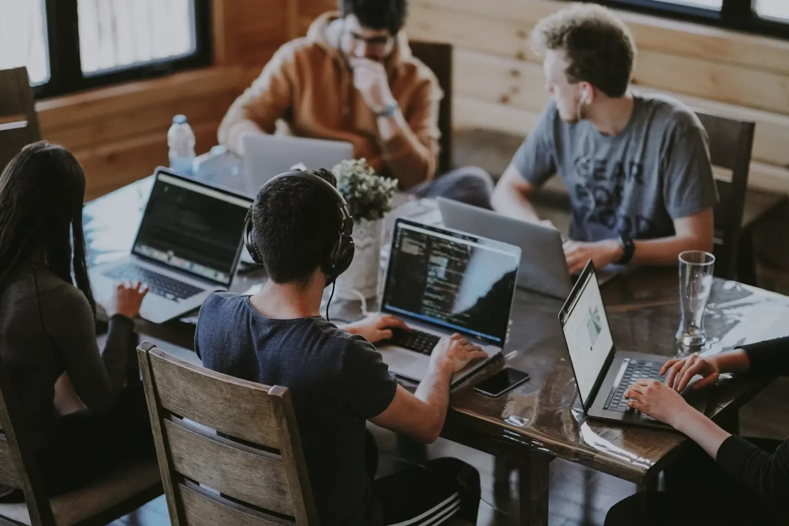 A team working on laptops